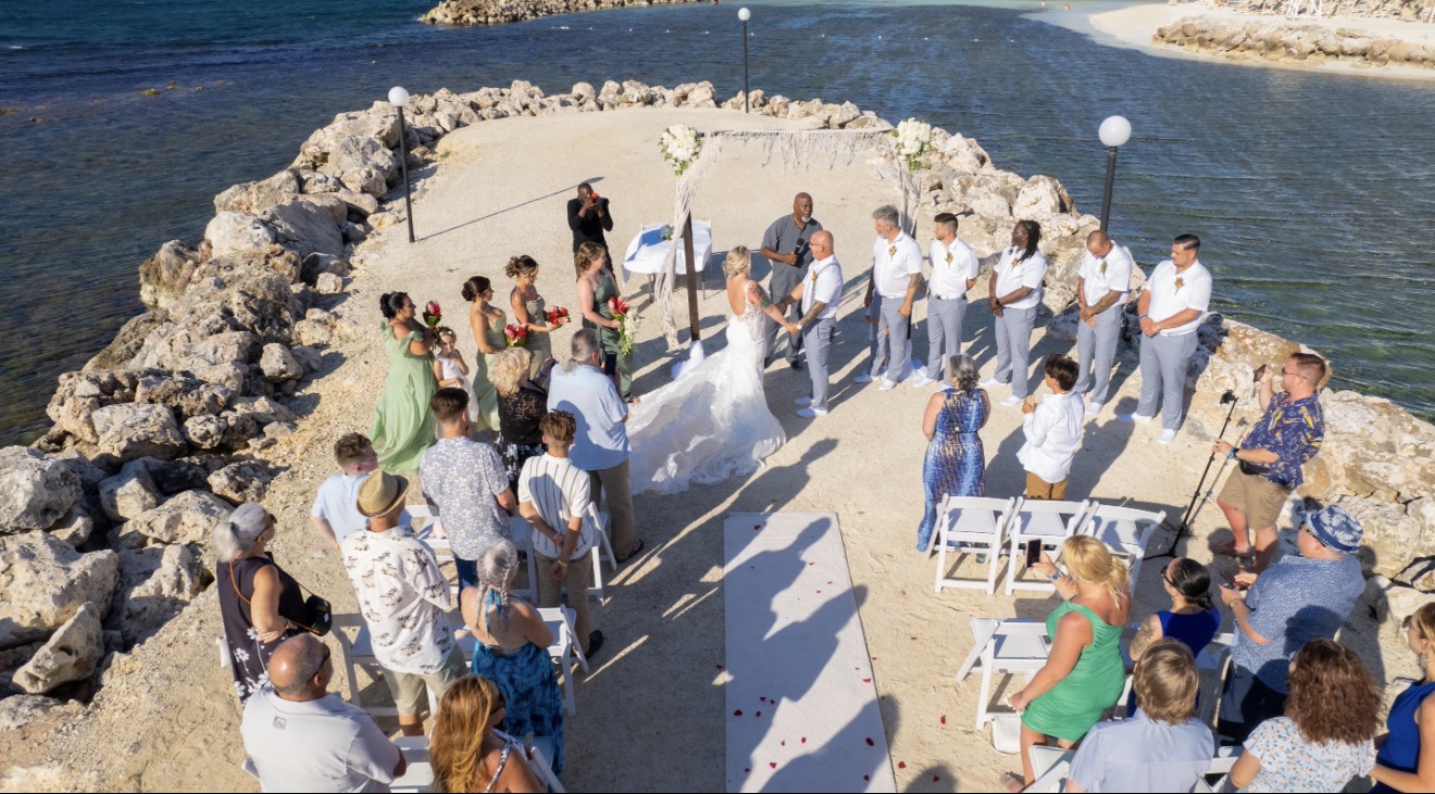 Destination wedding ceremony on a seaside jetty
